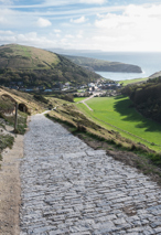 Cobble path through English Countryside heading to town