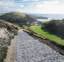 Cobble path through English Countryside heading to town