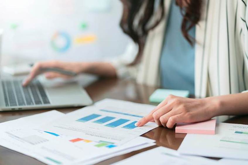 A person pointing at a graph on a paper

AI-generated content may be incorrect.